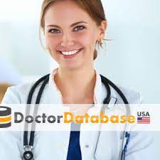 A smiling female doctor wearing a white coat and stethoscope is standing in front of a white background. The text "1.3 Million USA Doctors Email Database"